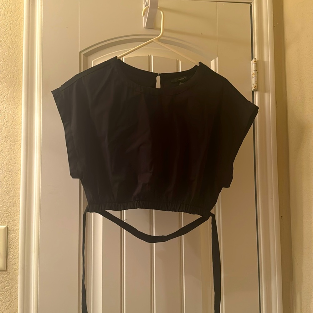 I am selling a Black Forever 21 crop top. Haven't been worn since I bought it.